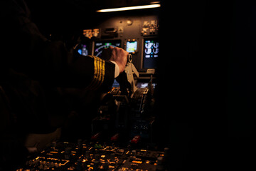 Male captain throttling engine to takeoff with aircraft jet, flying airplane with power dashboard...