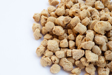 Textured soy protein on white background.
