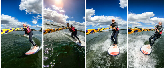 Adult man on a surfboard having fun doing wake surf on a lake behind a motorboat on a sunny summer day with blue sky