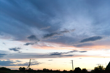 Sunset sun and beautiful clouds outside the city