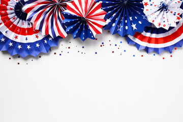 Labor day concept. Flat lay composition with USA flag color decorations paper fans and confetti on...