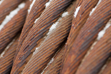 close up of a rusty metal cables and snow