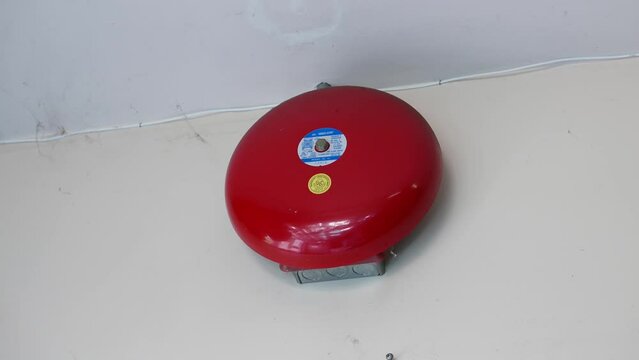 Red alarm bell on the wall at the Chinese restaurant