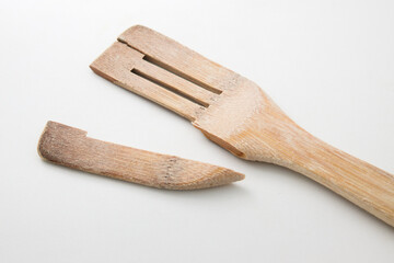 Close-up of a wooden spatula that has broken off at its weakest part