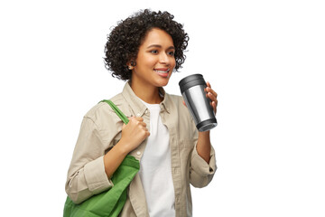 eco living, zero waste and sustainability concept - portrait of happy smiling woman s with green reusable canvas bag for food shopping and tumbler or thermo cup over white background