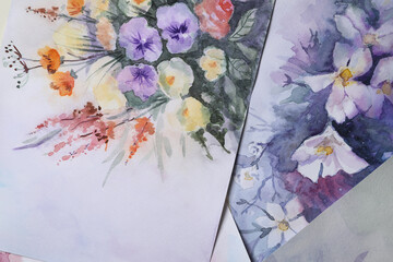 Paper sheets with beautiful floral watercolor paintings, closeup