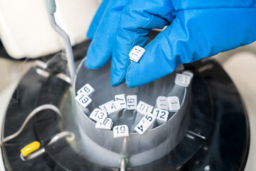 Embryologists a Liquid Nitrogen Bank Containing Sperm and Eggs Samples. ivf  in vitro fertilization, egg freezing. Sperm cryopreservation. Sperm freezing. - obrazy, fototapety, plakaty