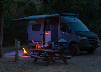 Van camping with fire and relaxing in nature