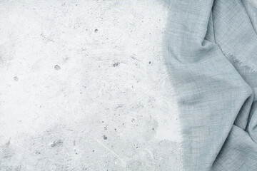 Grey background with grey textile napkin.