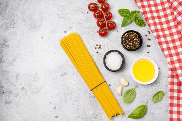 Food background from pasta, spices, herb on black table