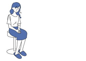 椅子に座る若い女性