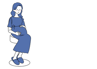 椅子に座る臨月の妊婦