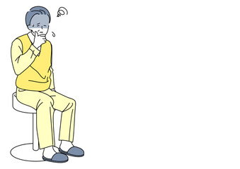 椅子に座るシニア男性