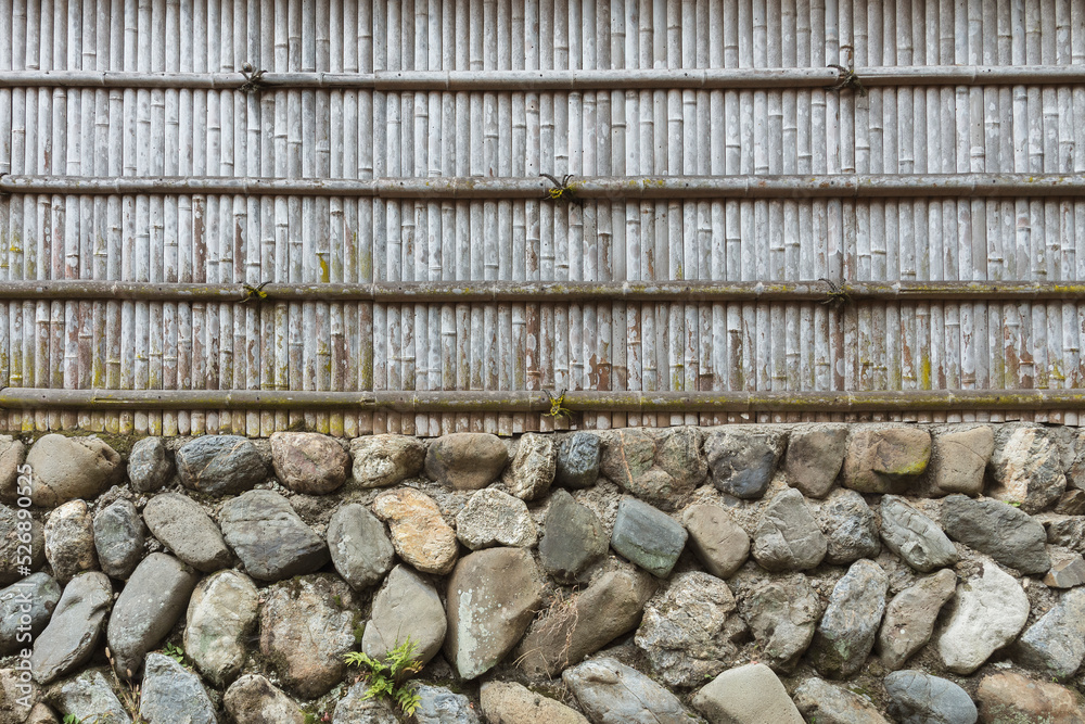 Poster stone wall and bamboo fence for pattern and background