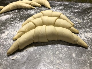 group of croissants before being baked