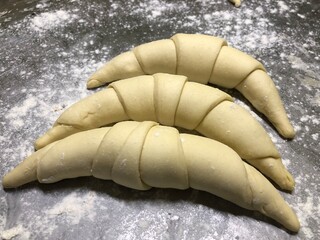 group of croissants before being baked