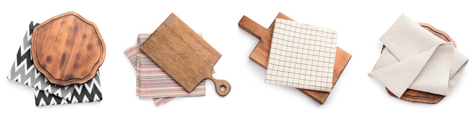 Set of wooden boards and napkins on white background, top view