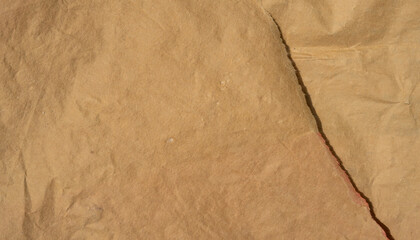 golden old paper with torn and crumpled texture for background
