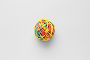 Colorful rubber band ball on light background