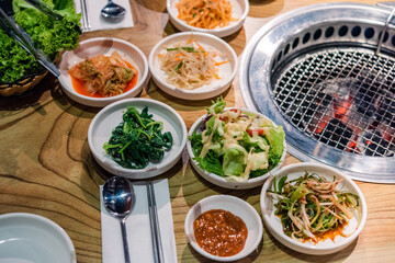 Spicy Kimchi group. Korean pickle or Pickled radish vegetables set and seasoning on bowl on stove serve wood table background, Japanese food
