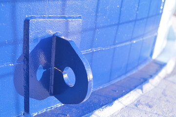Steel towing hook. Welded plumbing pipes. blue background