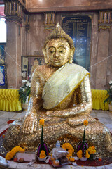 The Buddha statue was covered with gold leaf all over the body.