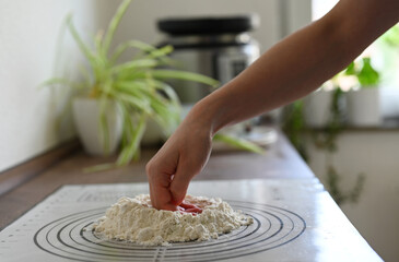 person making pasta at home