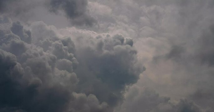 Time lapse dark storm clouds dramatic black sky background. Dark clouds before thunder storm coming. Meteorology danger windstorm climate. Dark cloudscape storm disaster timelapse gloomy gray sky.