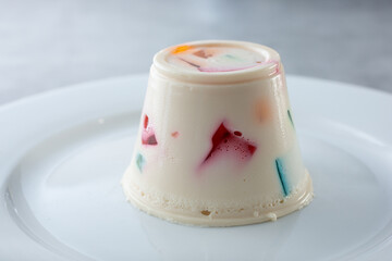 A view of a plate of molded fruit gelatin.