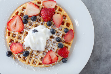 A top down view of a plate of waffles.