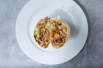 A top down view of a breakfast burrito.