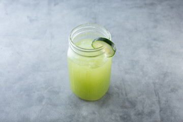 A view mason jar of cucumber agua fresca.
