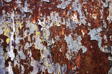 old rusty wall with traces of glue and paper