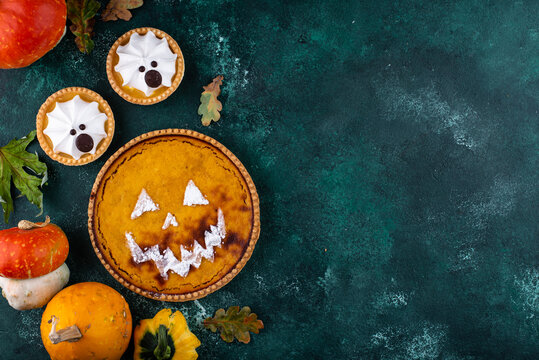 Halloween pumpkin pie in shape of jack-o-lantern