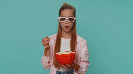 Excited teenager girl eating popcorn and watching interesting tv serial, sport game film, online...