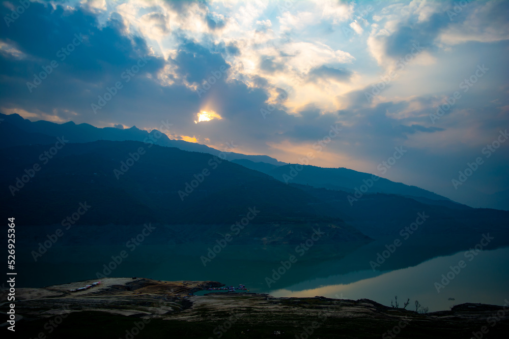 Wall mural Sunrise view of Tehri mountains. Scenery sunrise over Tehri Lake, Uttarakhand. Tehri Dam, the tallest dam in India and Tehri dam is Asia's largest man-made lake.