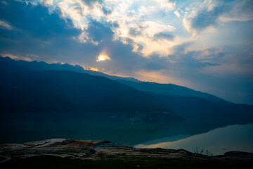 Sunrise view of Tehri mountains. Scenery sunrise over Tehri Lake, Uttarakhand. Tehri Dam, the tallest dam in India and Tehri dam is Asia's largest man-made lake.