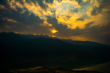 Sunrise view of Tehri mountains. Scenery sunrise over Tehri Lake, Uttarakhand. Tehri Dam, the tallest dam in India and Tehri dam is Asia's largest man-made lake.