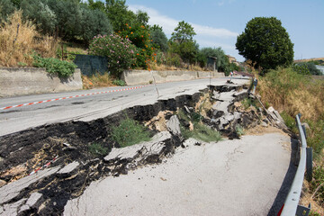 Big pothole on a national road in Sicily caused by landslide, carelessness and abandonment of road...