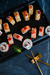 Sushi roll on black board