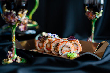 sushi rolls and glasses with wine romantic evening