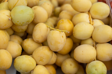 Ripe raw yellow dates for sale at the farmers market