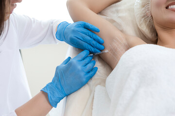 Beauty Injections and Cosmetology Concepts. Closeup of Young Caucasian Woman Getting Armpits Injection in Beauty Salon