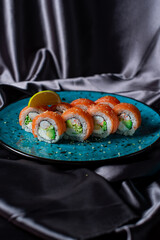 sushi rolls on the blue plate