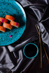 sushi rolls on the blue plate