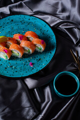 sushi rolls on the blue plate