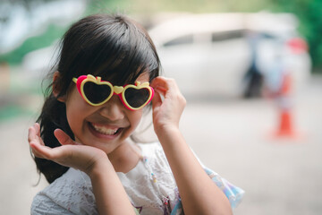 Beautiful girl wearing glasses with a big surprise on her face posing