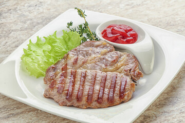 Grilled pork neck steak with ketchup