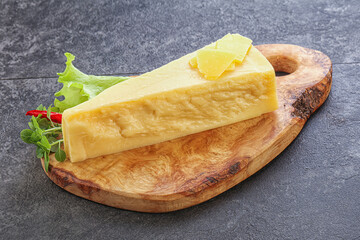 Parmesan cheese piece over board