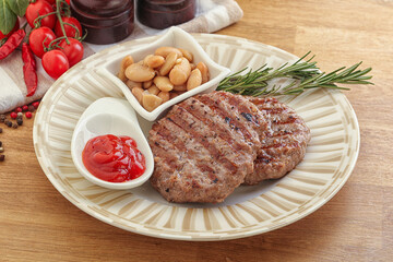 Grilled beef burger cutlet with sauce